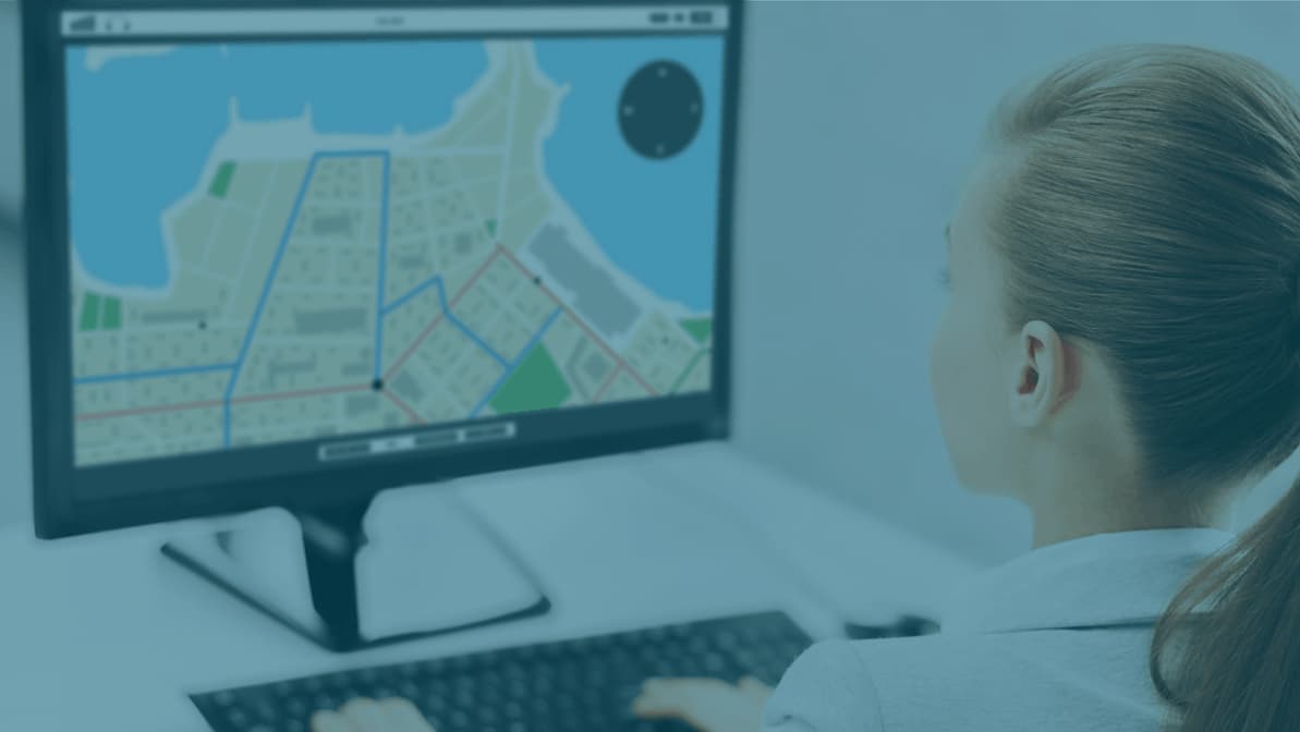 woman looking at map on monitor